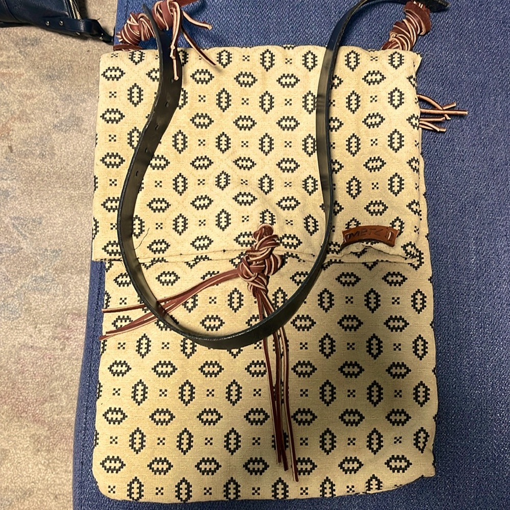 Fold over carry bag with leather handle and trim